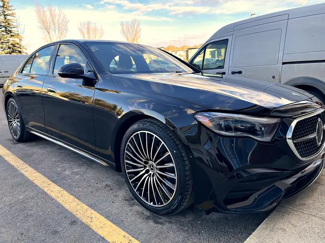 Black Mercedes-Benz E-Class, front three-quarter view
