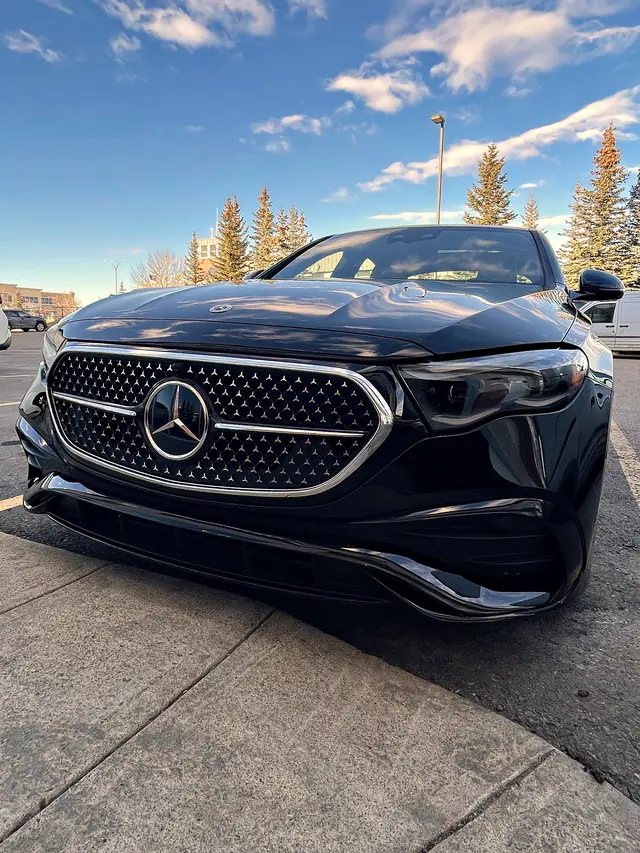 Black Mercedes-Benz E-Class, front view of the grille