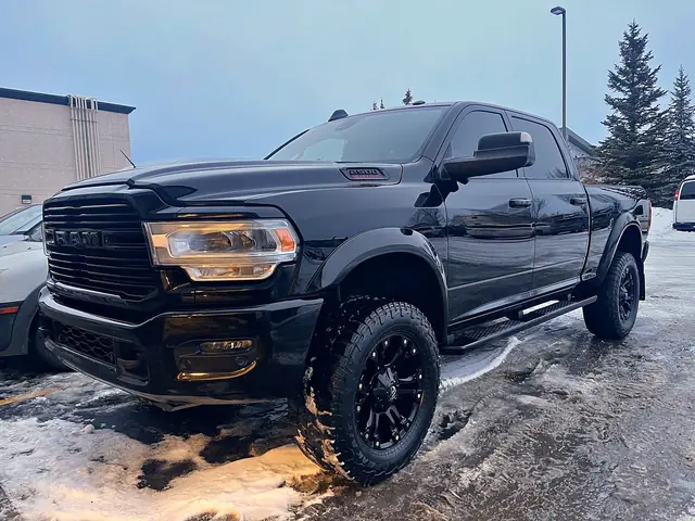Black Ram pickup with a clean, glossy finish on a winter evening